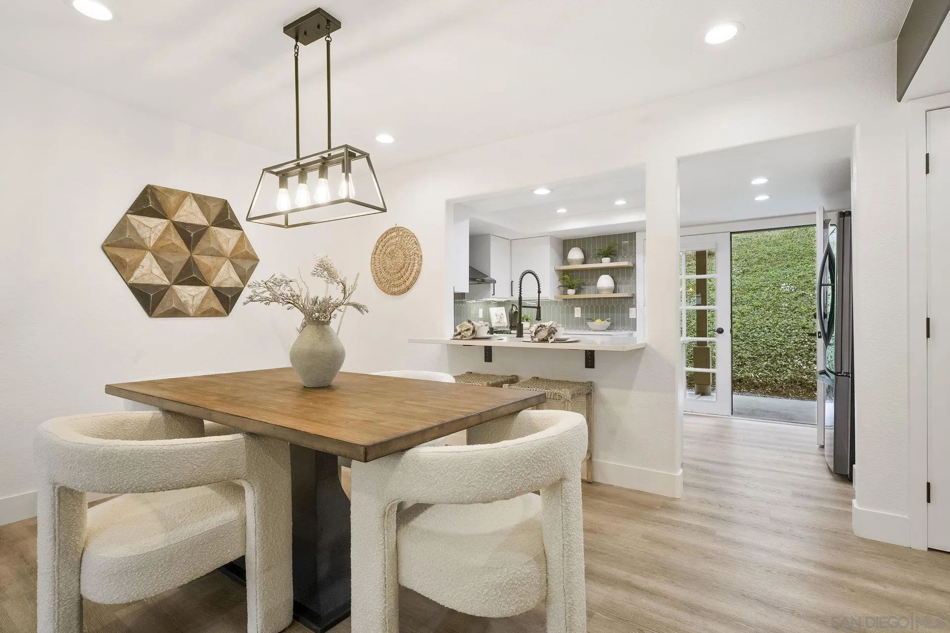 381 Playa Blanca Encinitas, CA 92024 - Photo 10 of 32 a kitchen with a table and chairs