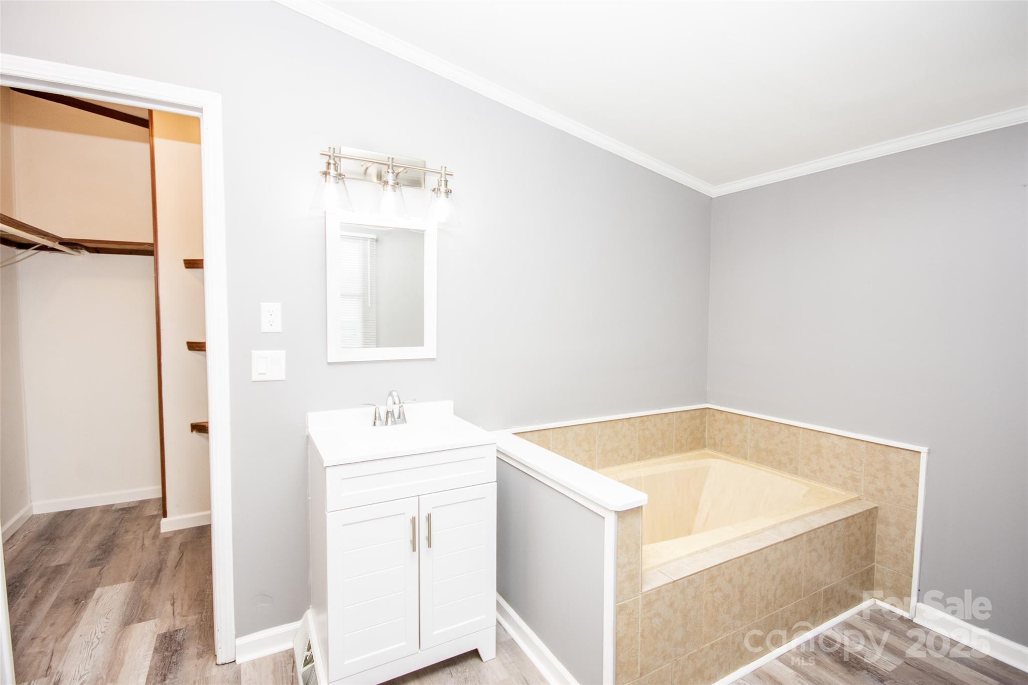 943 Tabor Road Olin, NC 28660 - Photo 17 of 31 a bathroom with a tub sink and mirror