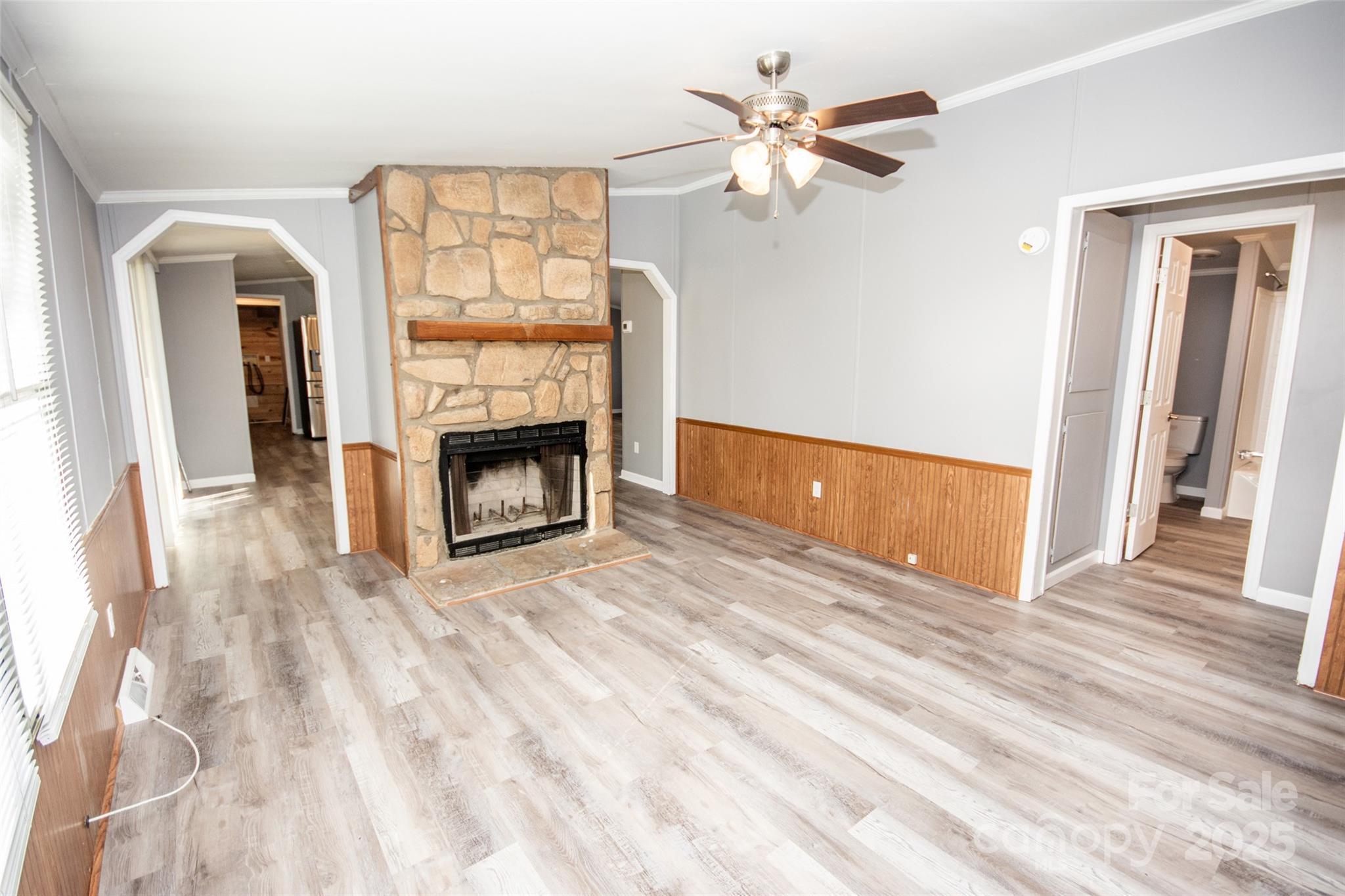 943 Tabor Road Olin, NC 28660 - Photo 23 of 31 a view of an empty room with wooden floor fireplace and a window