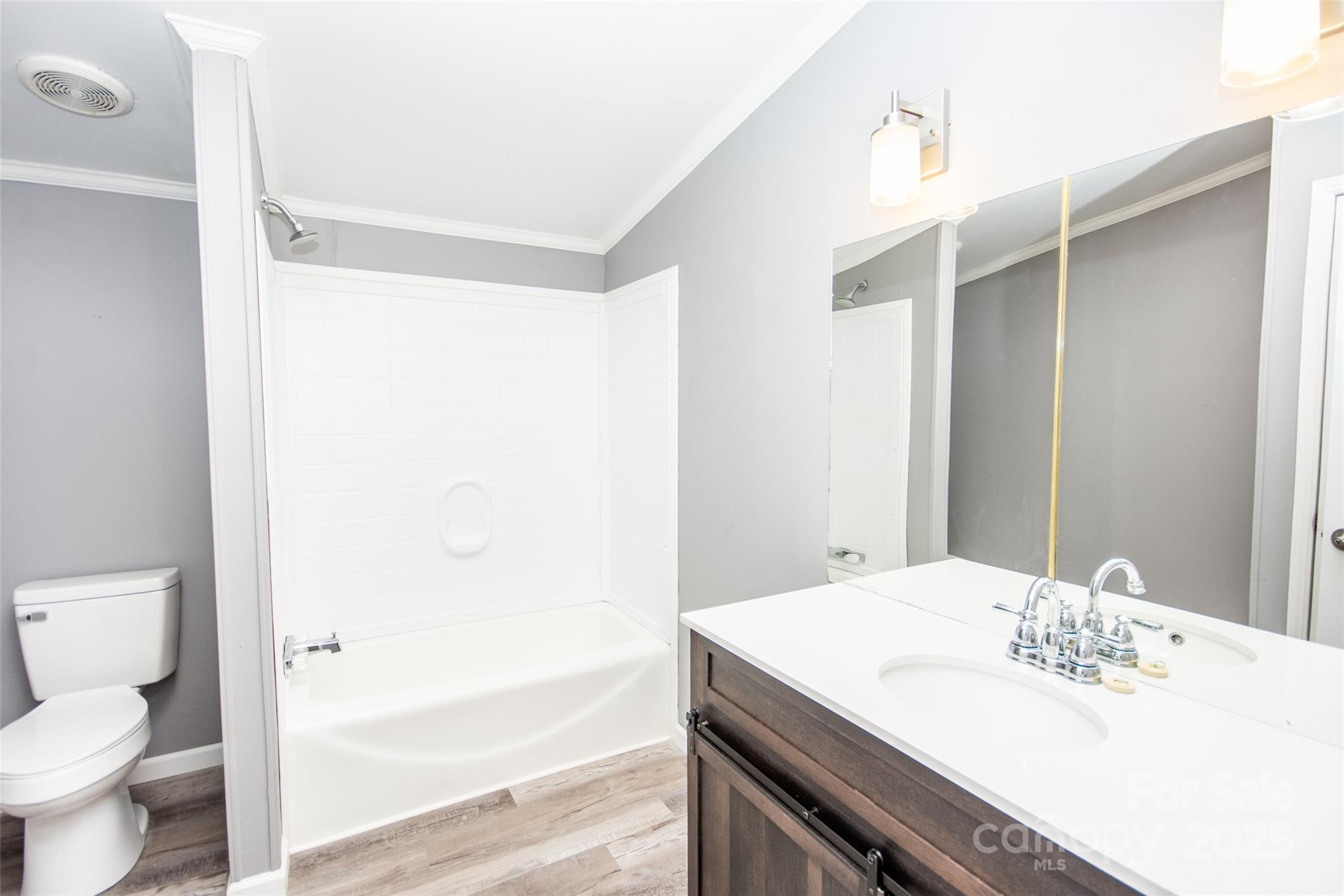 943 Tabor Road Olin, NC 28660 - Photo 25 of 31 a bathroom with a sink a toilet and shower