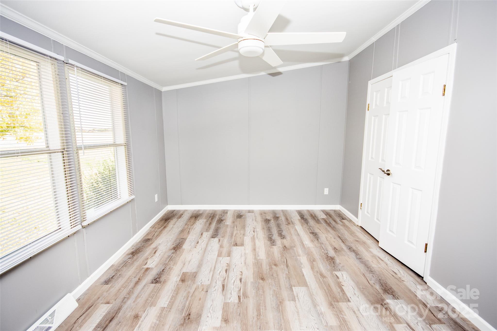 943 Tabor Road Olin, NC 28660 - Photo 27 of 31 wooden floor in an empty room with a window
