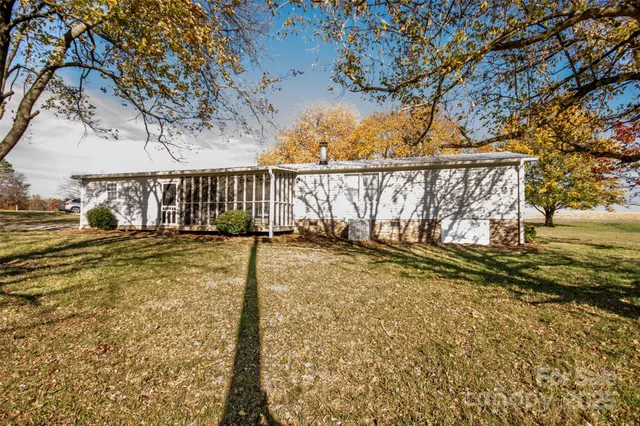 a view of a garden with wooden fence