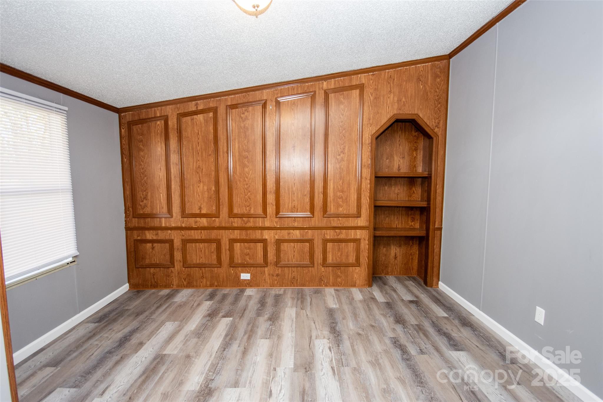 943 Tabor Road Olin, NC 28660 - Photo 8 of 31 a view of walk in closet with empty racks