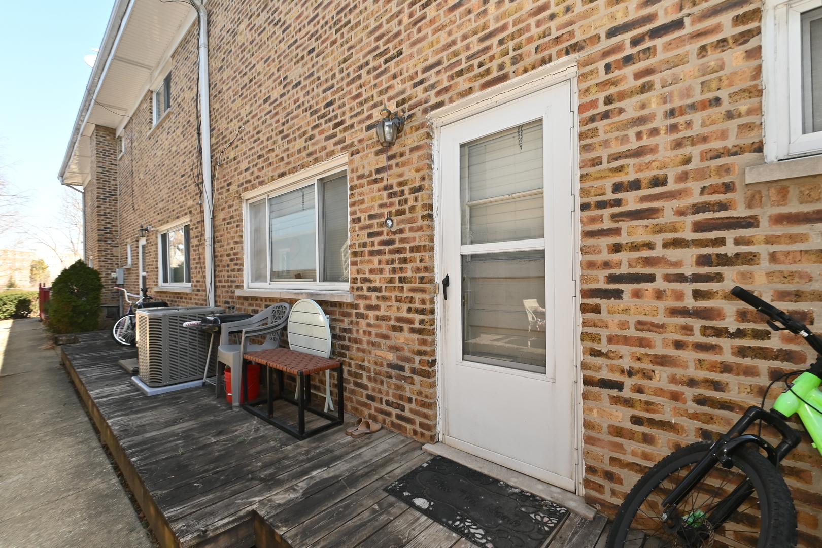 32 1st Street Wheeling, IL 60090 - Photo 12 of 14 a view of a balcony with chairs and wooden floor