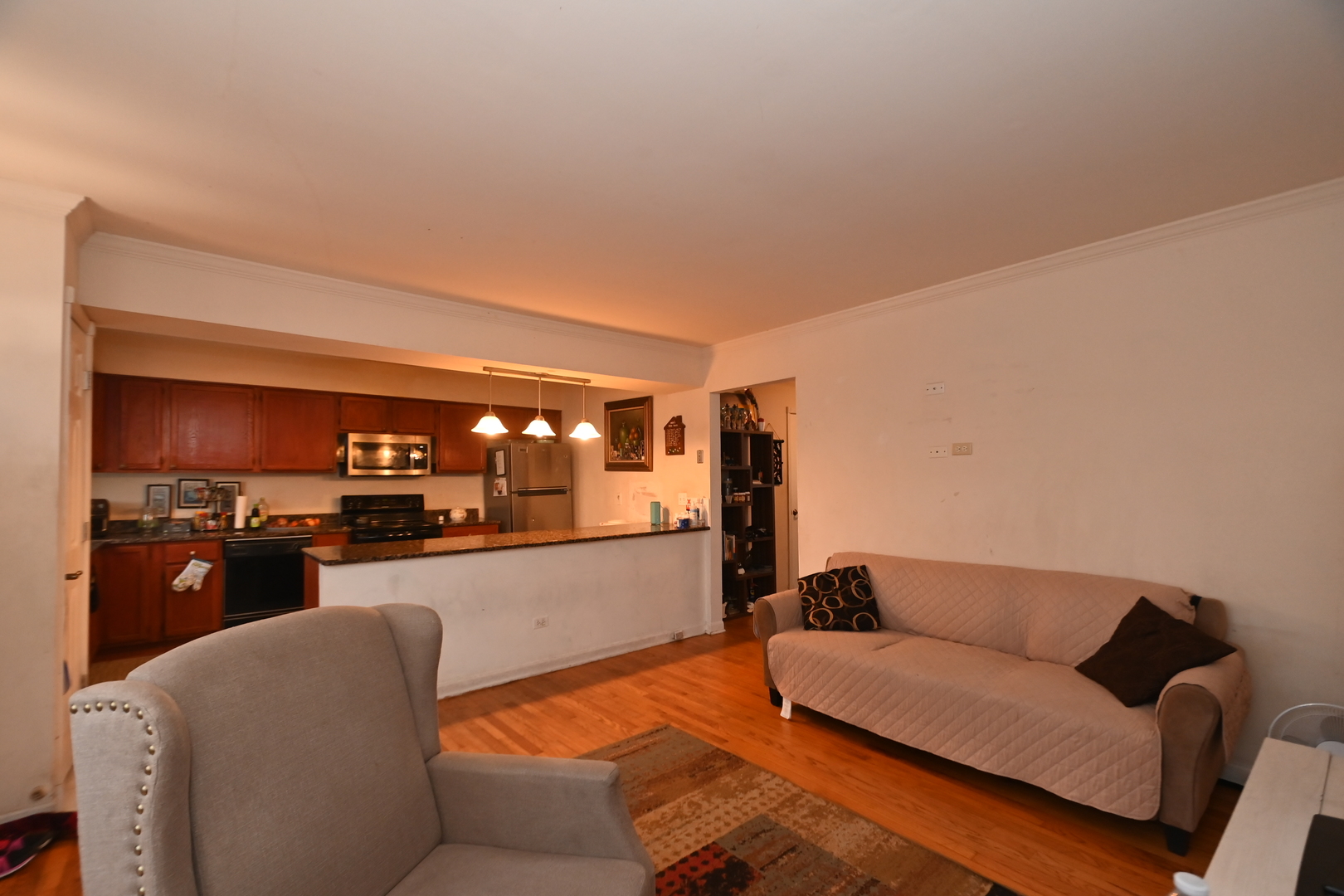 32 1st Street Wheeling, IL 60090 - Photo 3 of 14 a living room with furniture and a flat screen tv