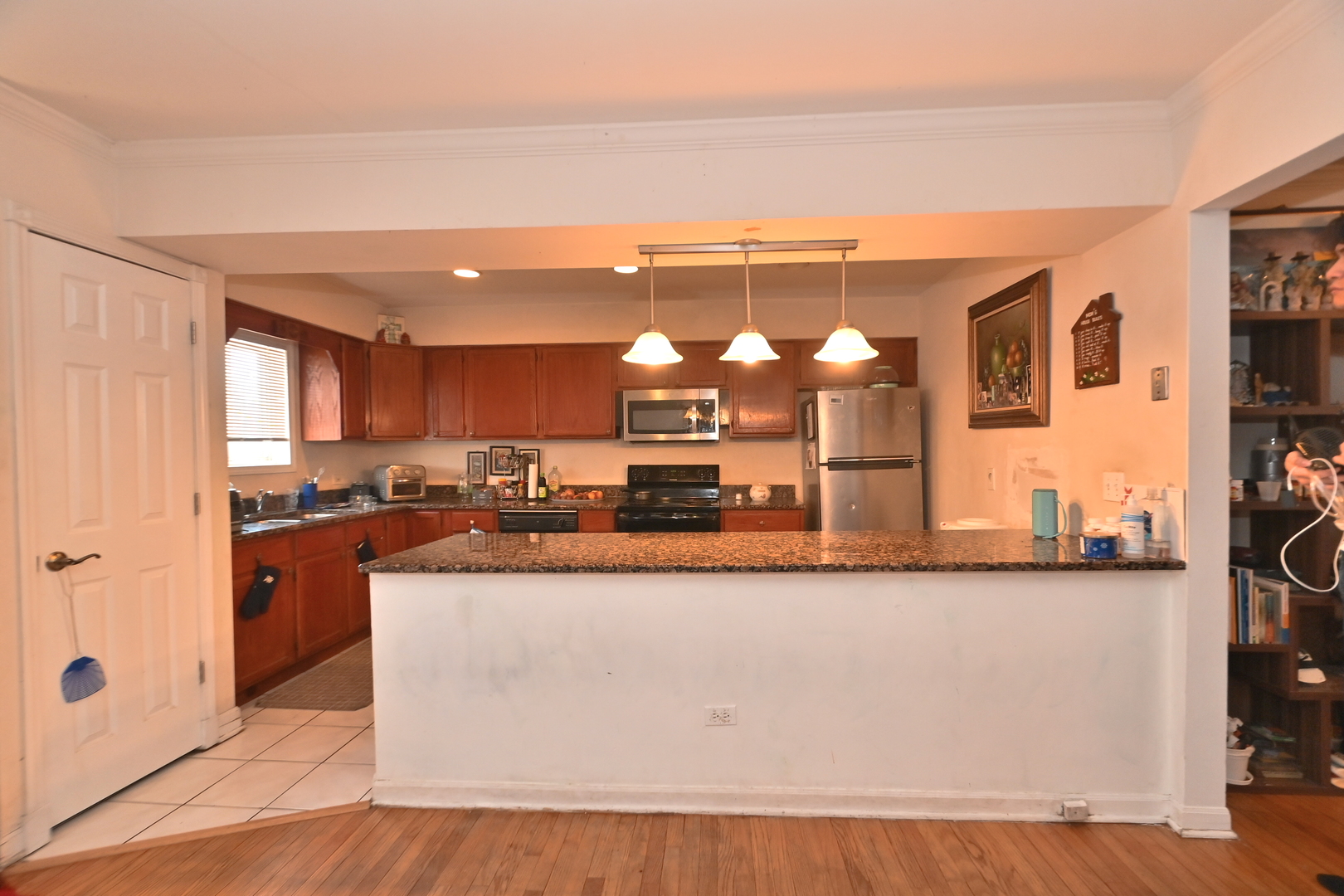 32 1st Street Wheeling, IL 60090 - Photo 4 of 14 a large kitchen with stainless steel appliances granite countertop a large counter top and a dresser
