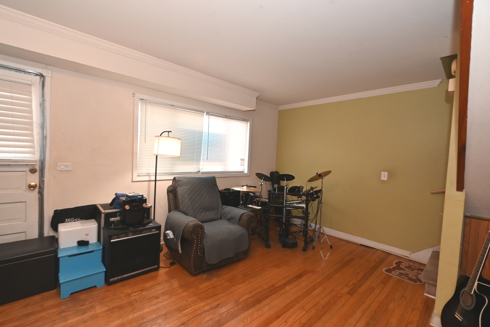 32 1st Street Wheeling, IL 60090 - Photo 7 of 14 a living room with furniture and a wooden floor