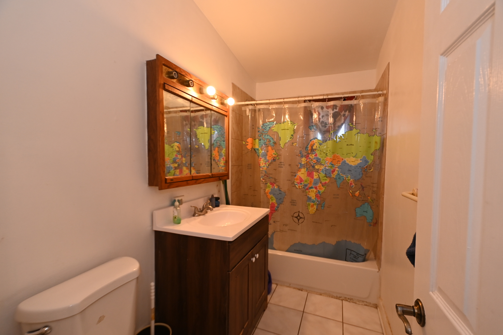 32 1st Street Wheeling, IL 60090 - Photo 8 of 14 a bathroom with a sink a toilet and shower