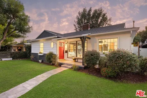 a view of a house with a back yard