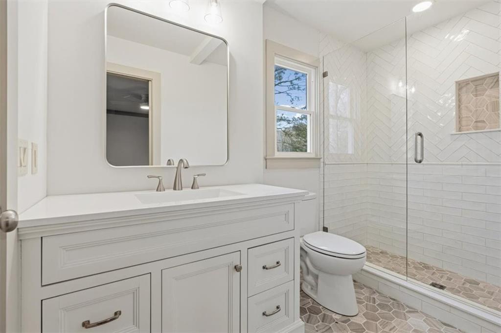 49 Apache Trail Cartersville, GA 30120 - Photo 33 of 52 a bathroom with a sink a toilet and shower