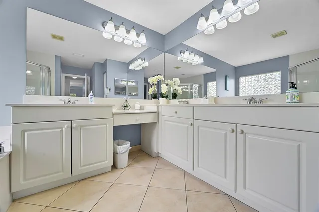 a kitchen with granite countertop a refrigerator and a sink