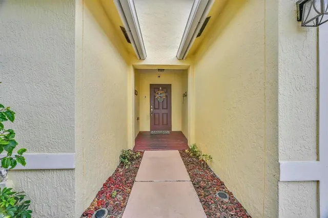 a bathroom with a tub shower and sink