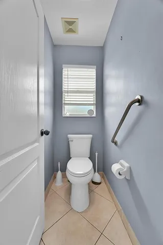 a kitchen with stainless steel appliances granite countertop a stove a refrigerator and a sink