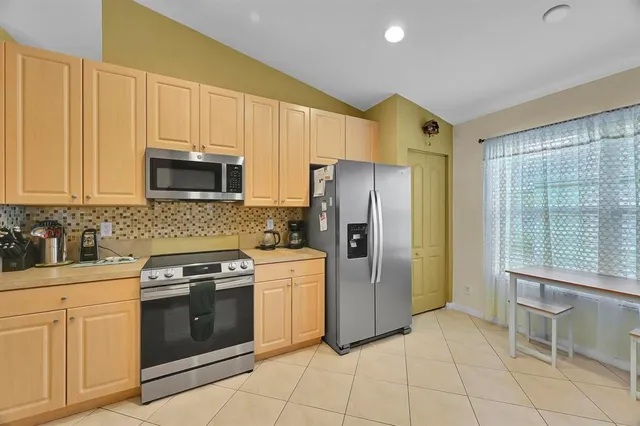 a view of a street with a tree