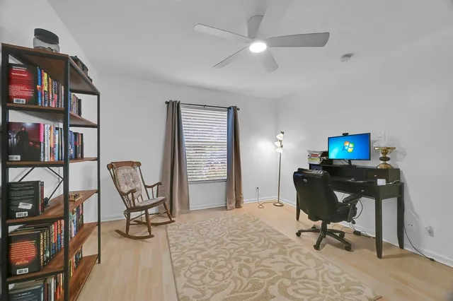 a view of a dining room with furniture wooden floor and chandelier