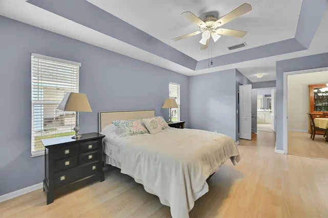 a swimming pool with patio outdoor seating and yard