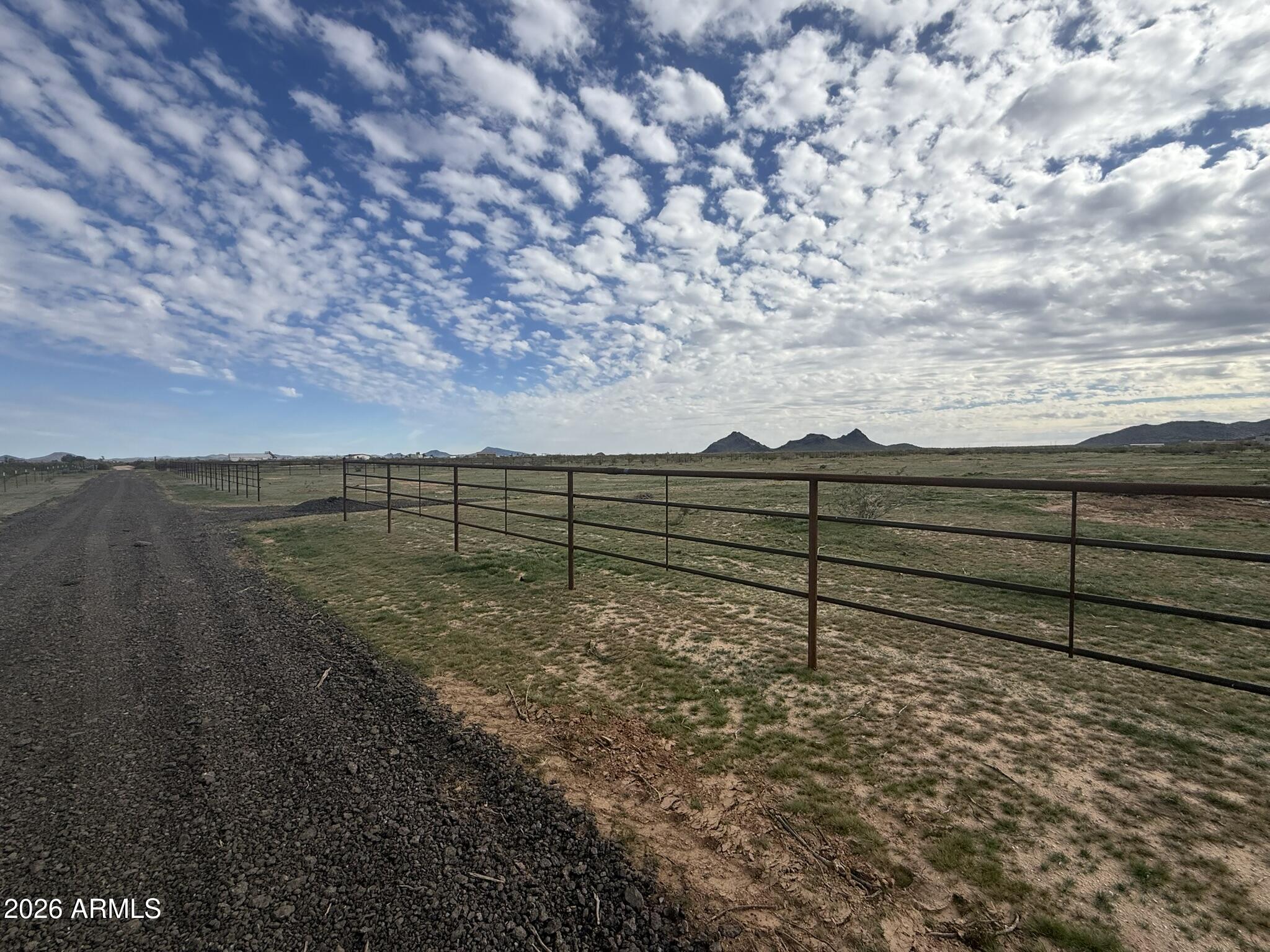 -xxa4 West Williams Road, Unit 5 Aguila, AZ 85320 - Photo 13 of 18 a view of a backyard with wooden fence