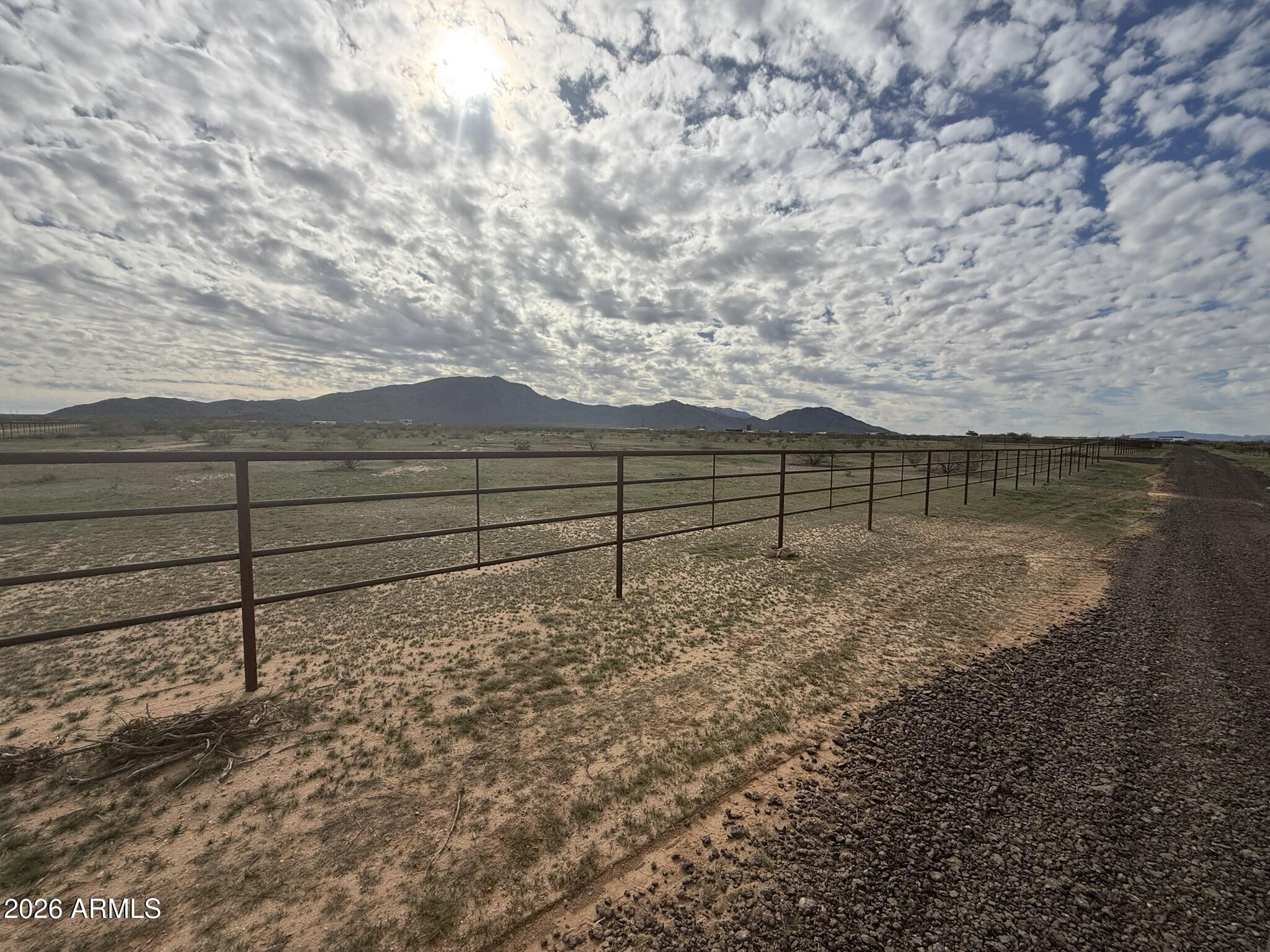 -xxa4 West Williams Road, Unit 5 Aguila, AZ 85320 - Photo 5 of 18 a view of a yard with wooden fence