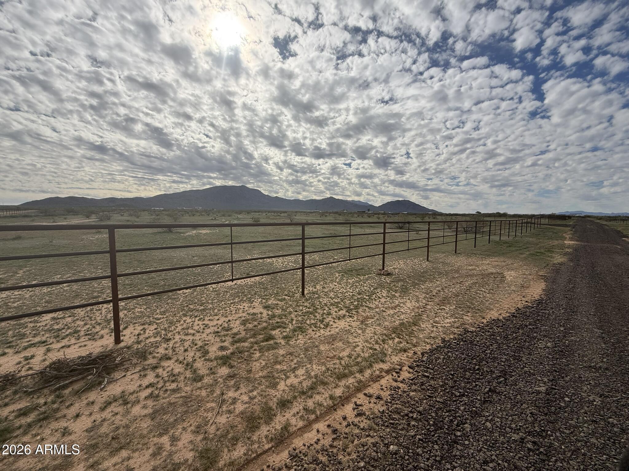 -xxa4 West Williams Road, Unit 5 Aguila, AZ 85320 - Photo 6 of 18 a view of a yard with wooden fence
