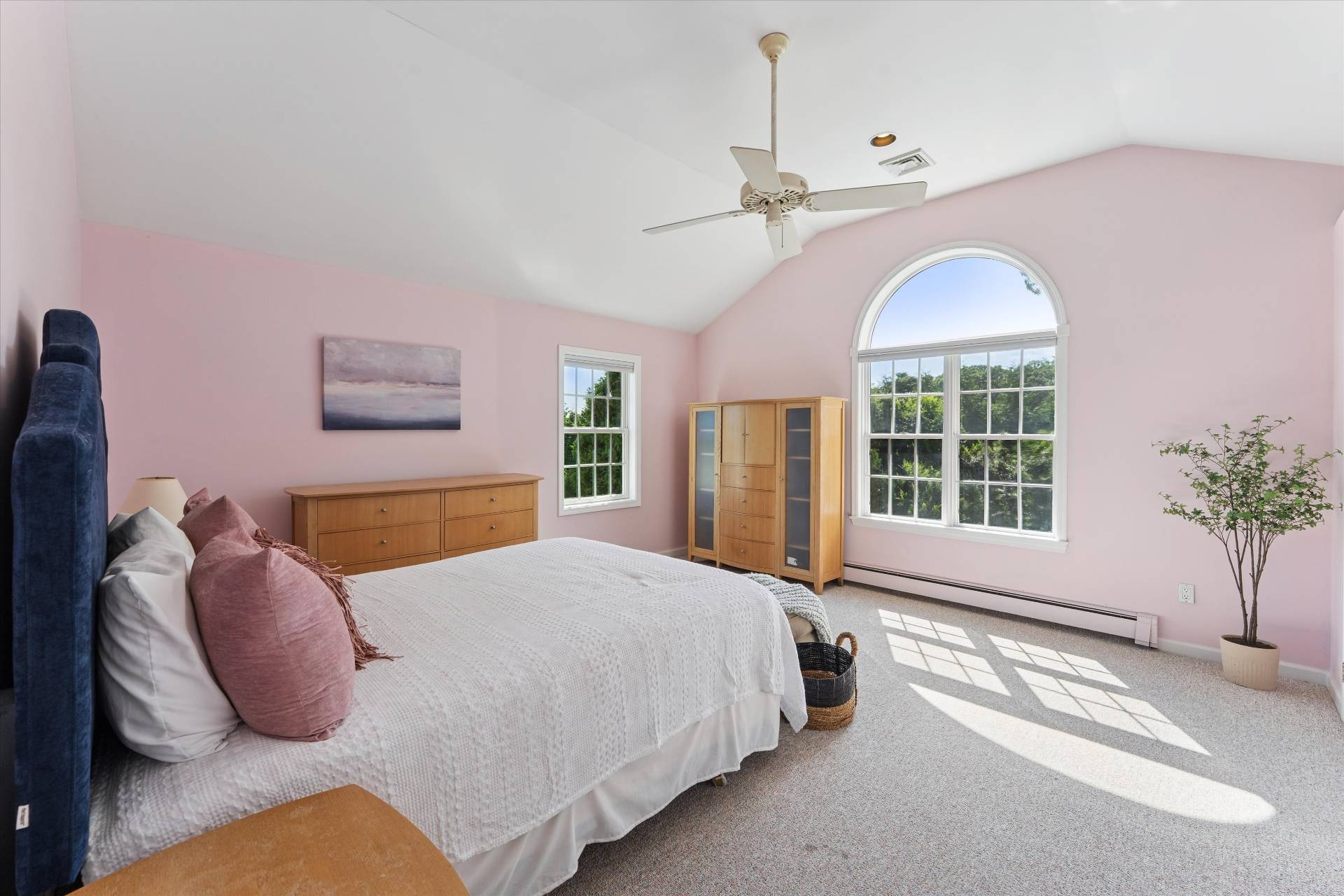 19 Maple Street Westhampton Beach, NY 11978 - Photo 13 of 23 a spacious bedroom with a bed and a large window