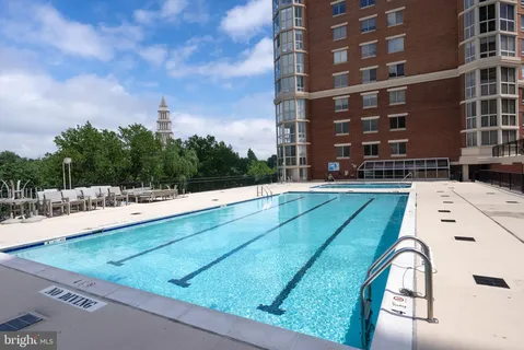 a view of swimming pool from a lounge chair