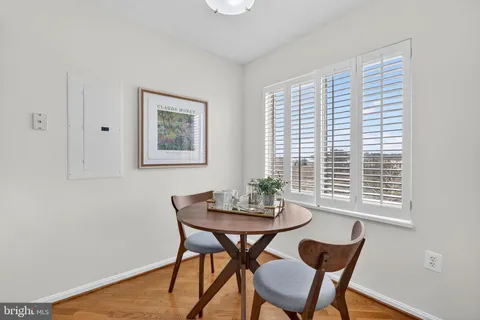 a view of a dining room with furniture and window