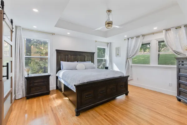 a room with a bed and a view of balcony