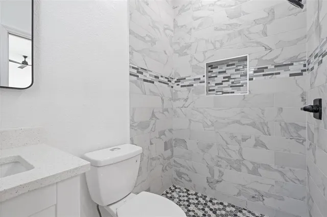 a bathroom with a toilet and a sink