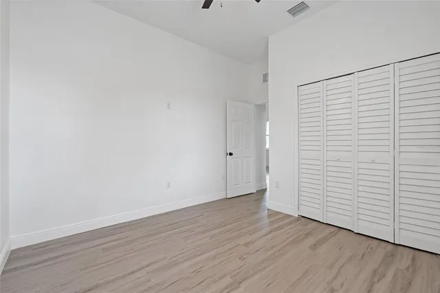 an empty room with wooden floor