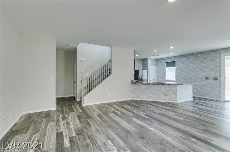 5475 Ordesa Valley Road Las Vegas, NV 89148 - Photo 34 of 35 An open floorplan seamlessly connects the living space to a well-appointed kitchen.