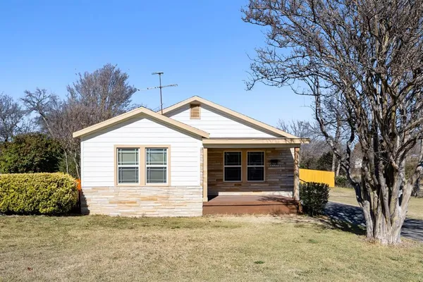 a view of a house with a snow and a yard