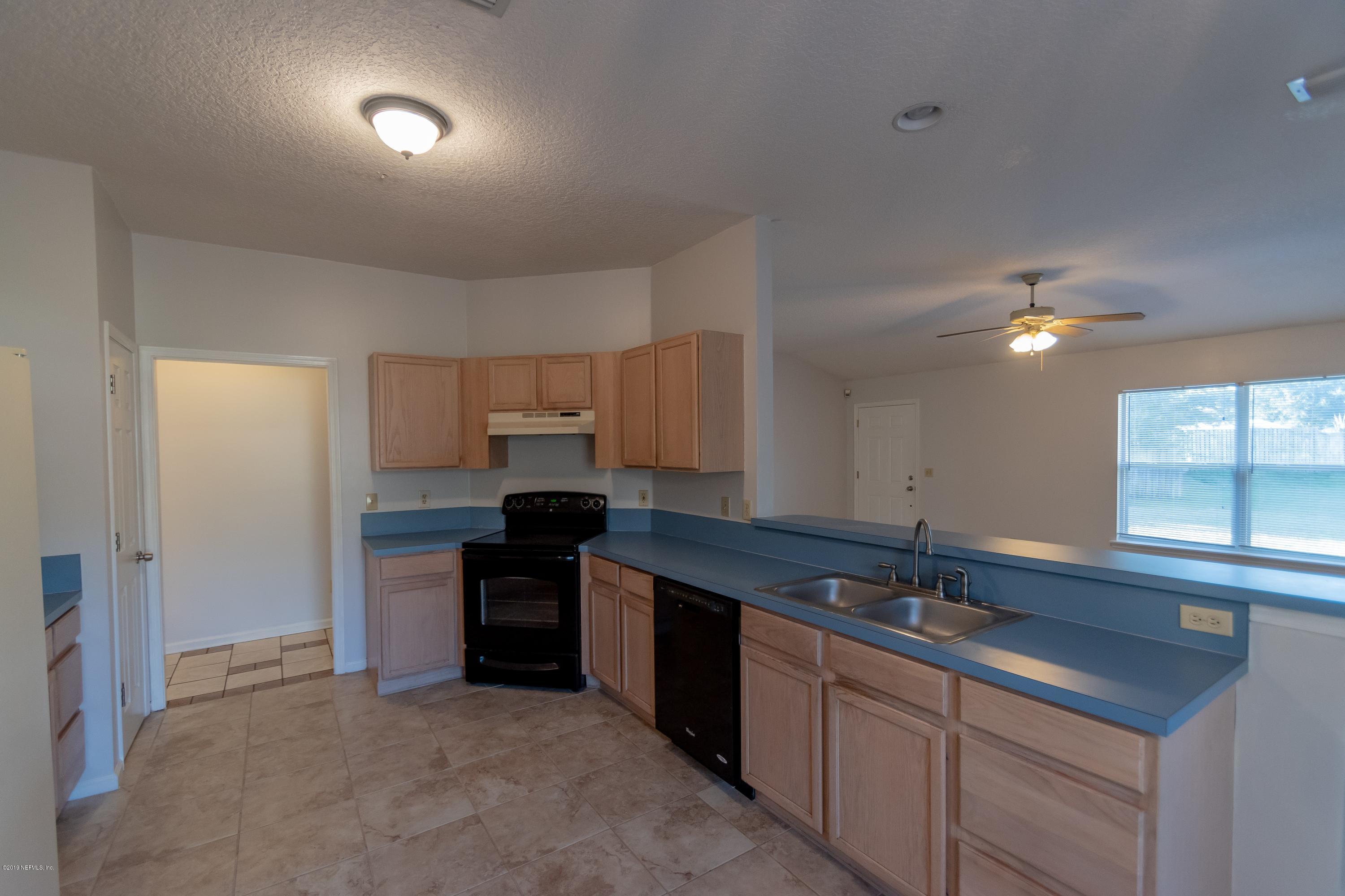 11367 Old Gainesville Road Jacksonville, FL 32221 - Photo 15 of 54 a kitchen with a sink and cabinets