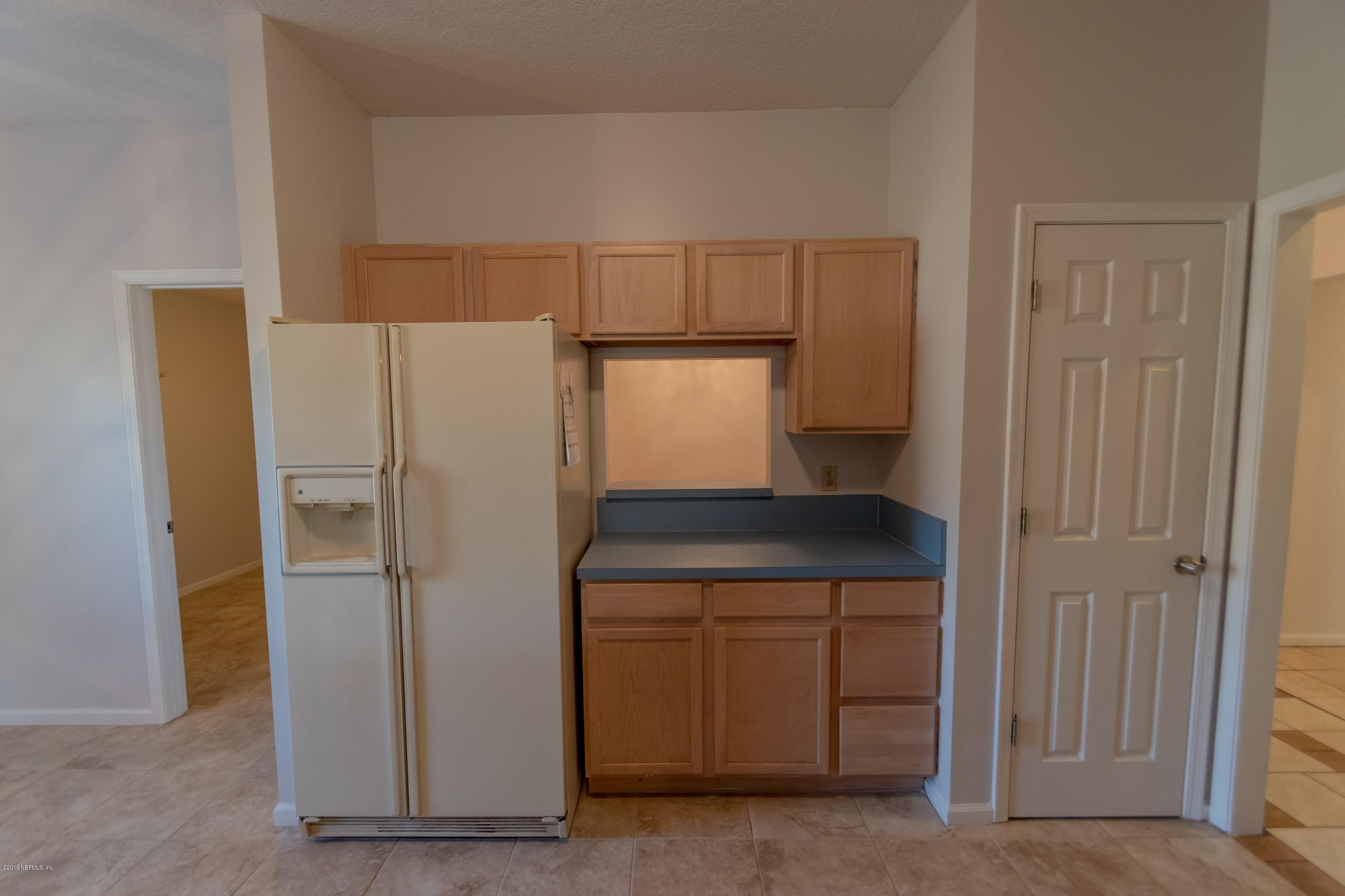 11367 Old Gainesville Road Jacksonville, FL 32221 - Photo 17 of 54 a kitchen with a refrigerator and a sink