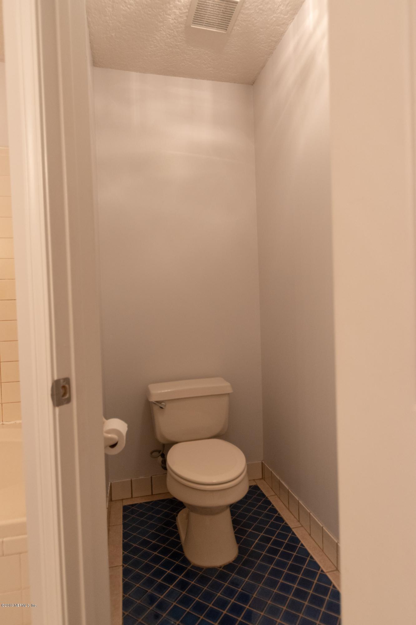 11367 Old Gainesville Road Jacksonville, FL 32221 - Photo 23 of 54 a white toilet sitting in a bathroom