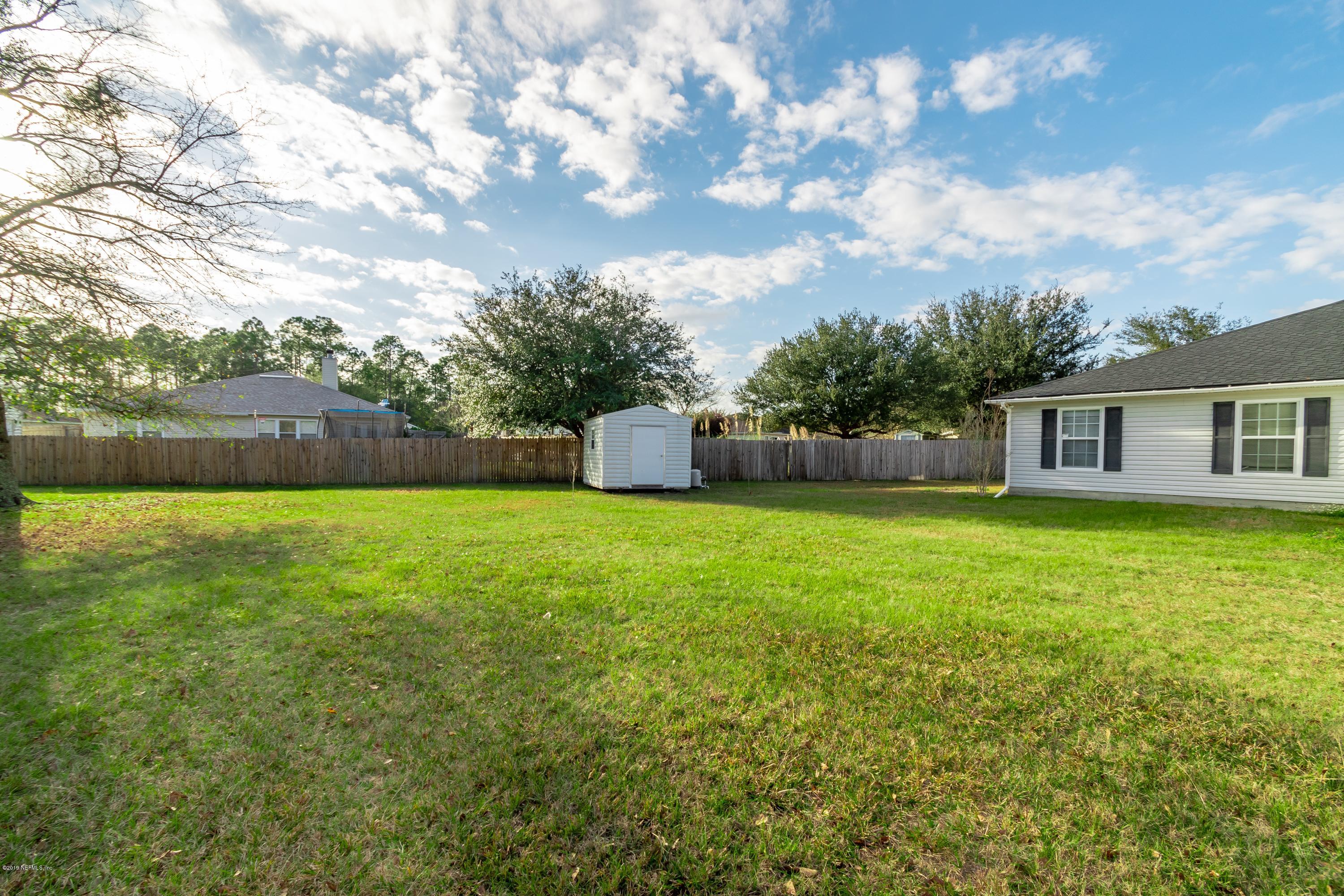 11367 Old Gainesville Road Jacksonville, FL 32221 - Photo 3 of 54 a backyard of a house with lots of green space