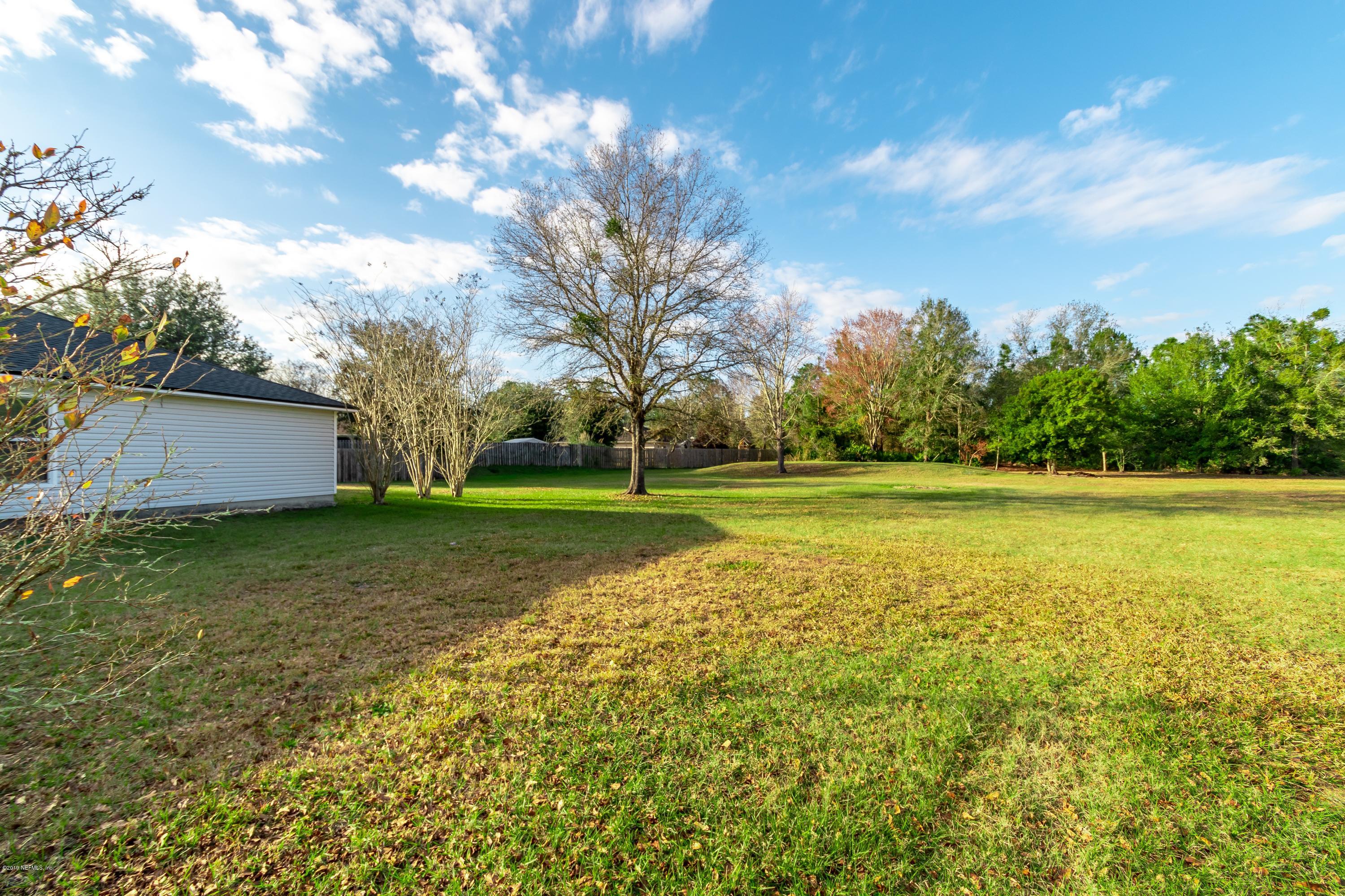 11367 Old Gainesville Road Jacksonville, FL 32221 - Photo 8 of 54 a view of a house with a big yard