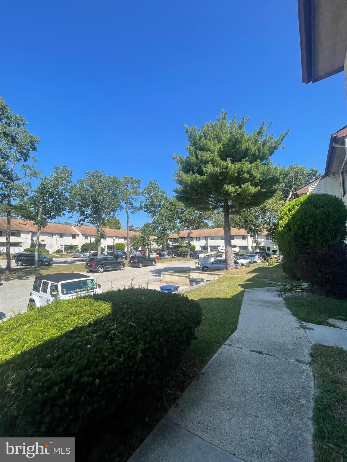 2123 Rhododendron Court Mays Landing, NJ 08330 - Photo 3 of 27 a view of yard with swimming pool outdoor seating and green field