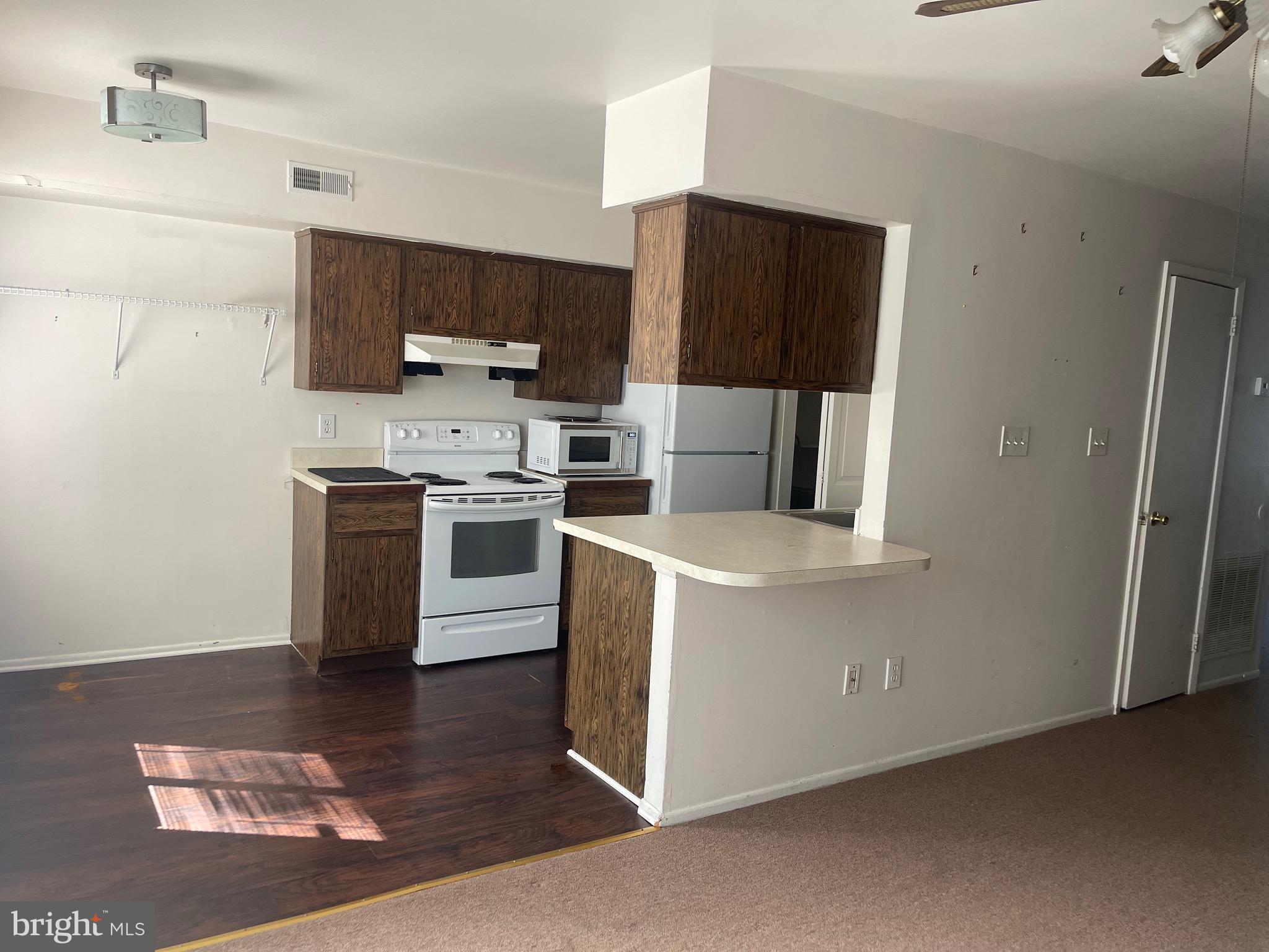 2123 Rhododendron Court Mays Landing, NJ 08330 - Photo 9 of 27 a kitchen with stainless steel appliances granite countertop a stove a refrigerator and a microwave