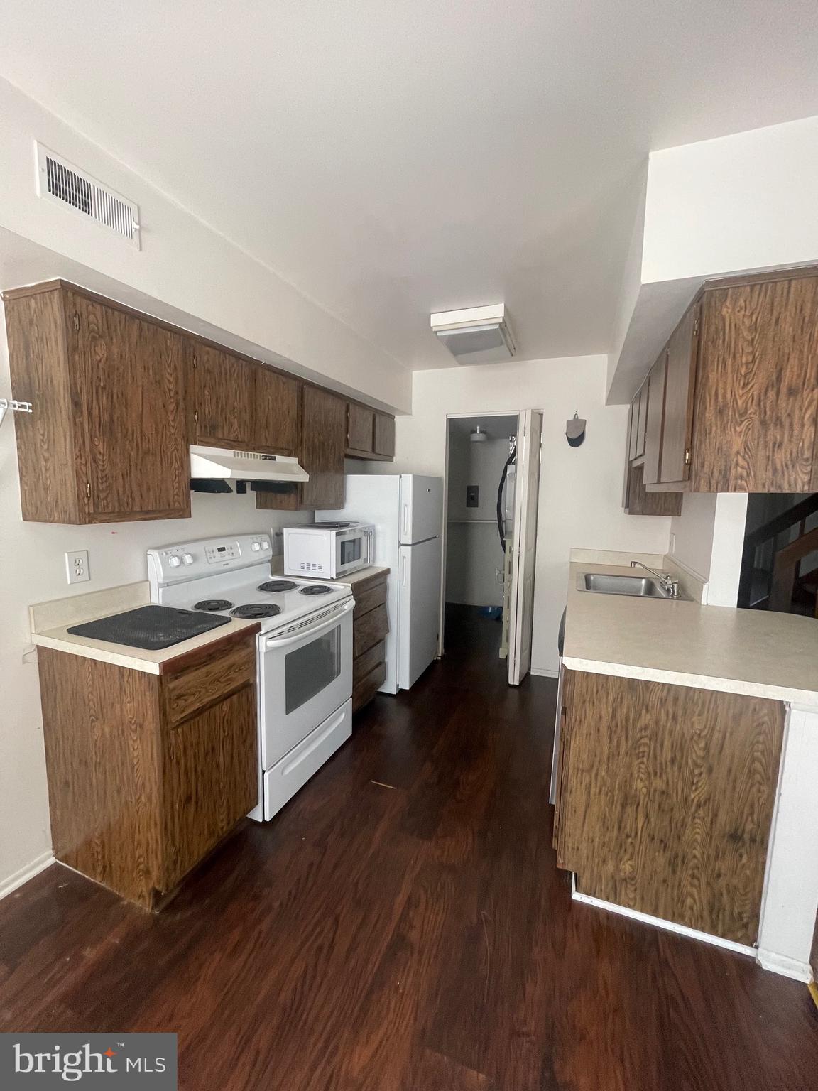 2123 Rhododendron Court Mays Landing, NJ 08330 - Photo 10 of 27 a kitchen with a stove a sink and a refrigerator