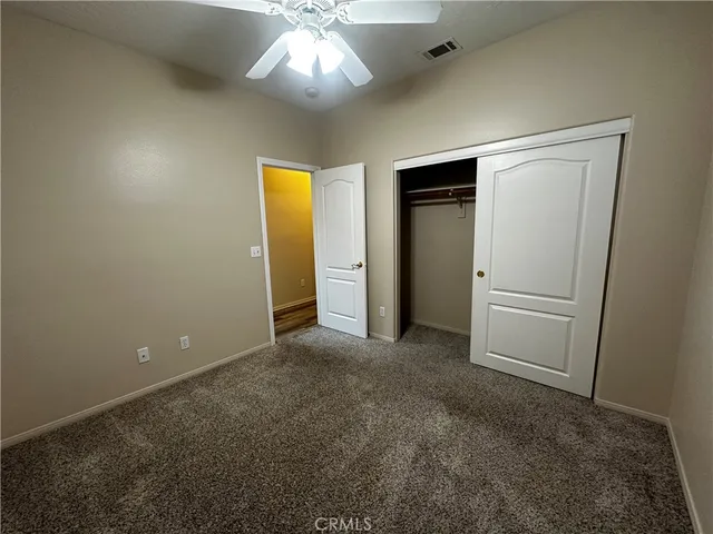 a bathroom with a granite countertop sink a mirror and a bathtub
