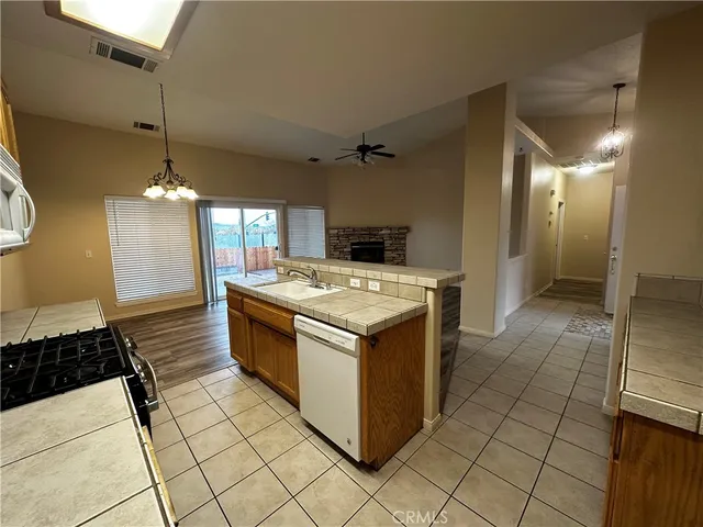 a kitchen with a stove and a sink
