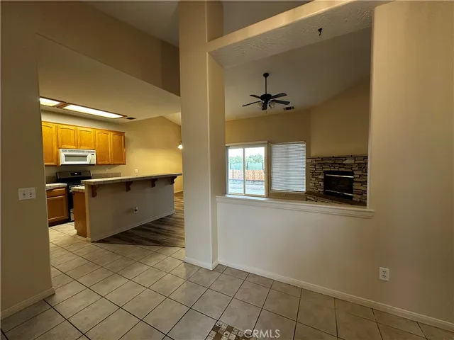 a view of a hallway with wooden shelves