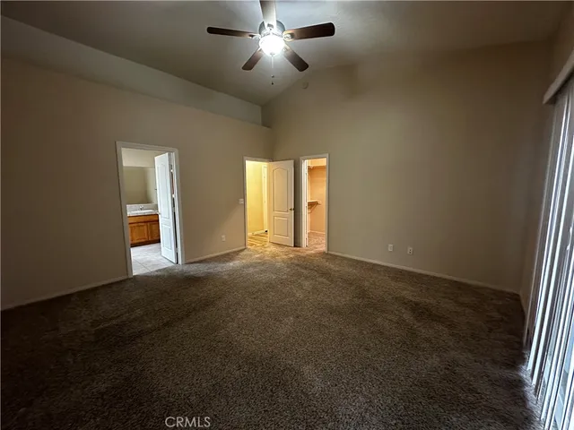 a bathroom with a tub sink shower and mirror