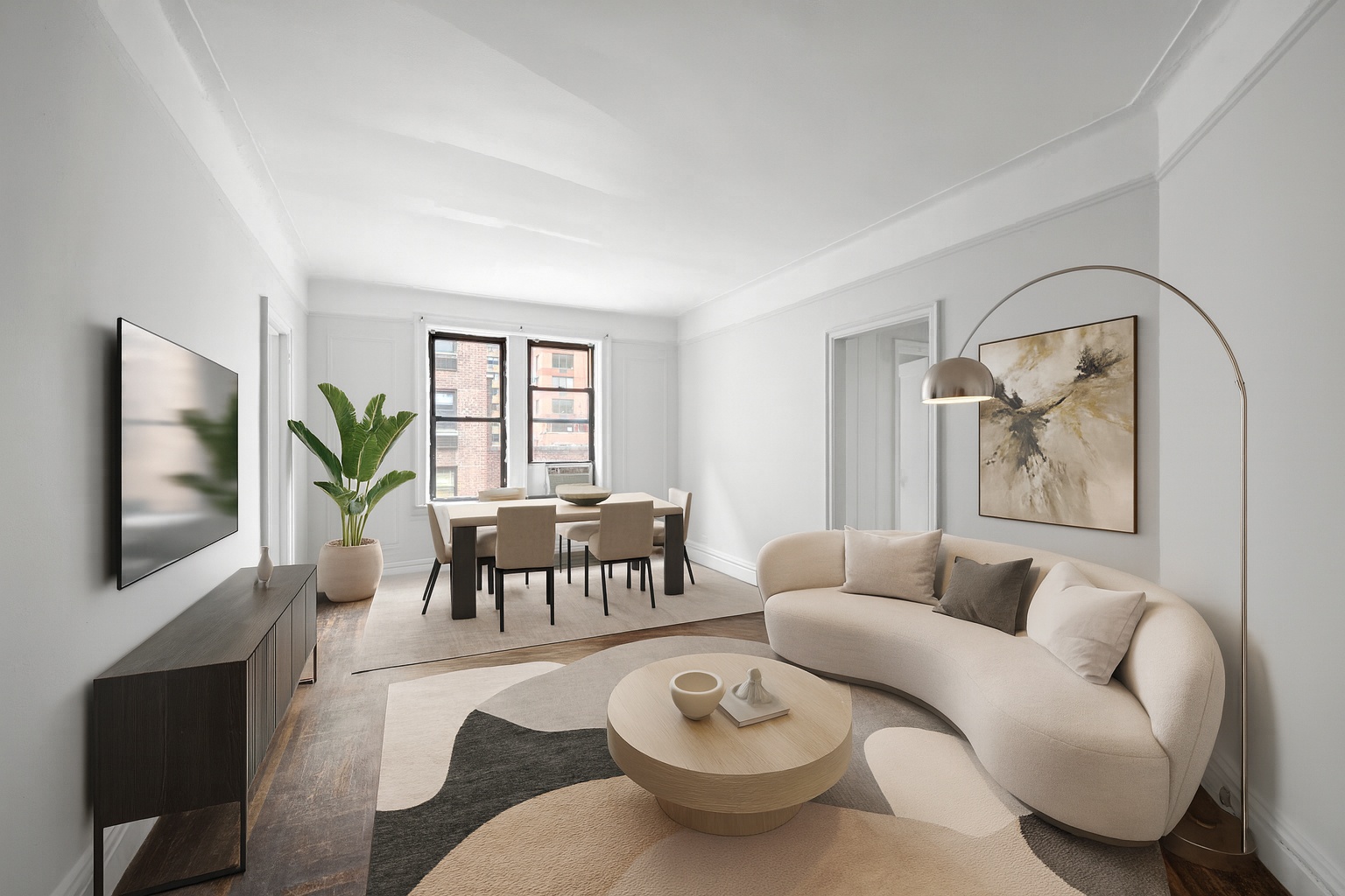 a living room with furniture a couch and a flat screen tv