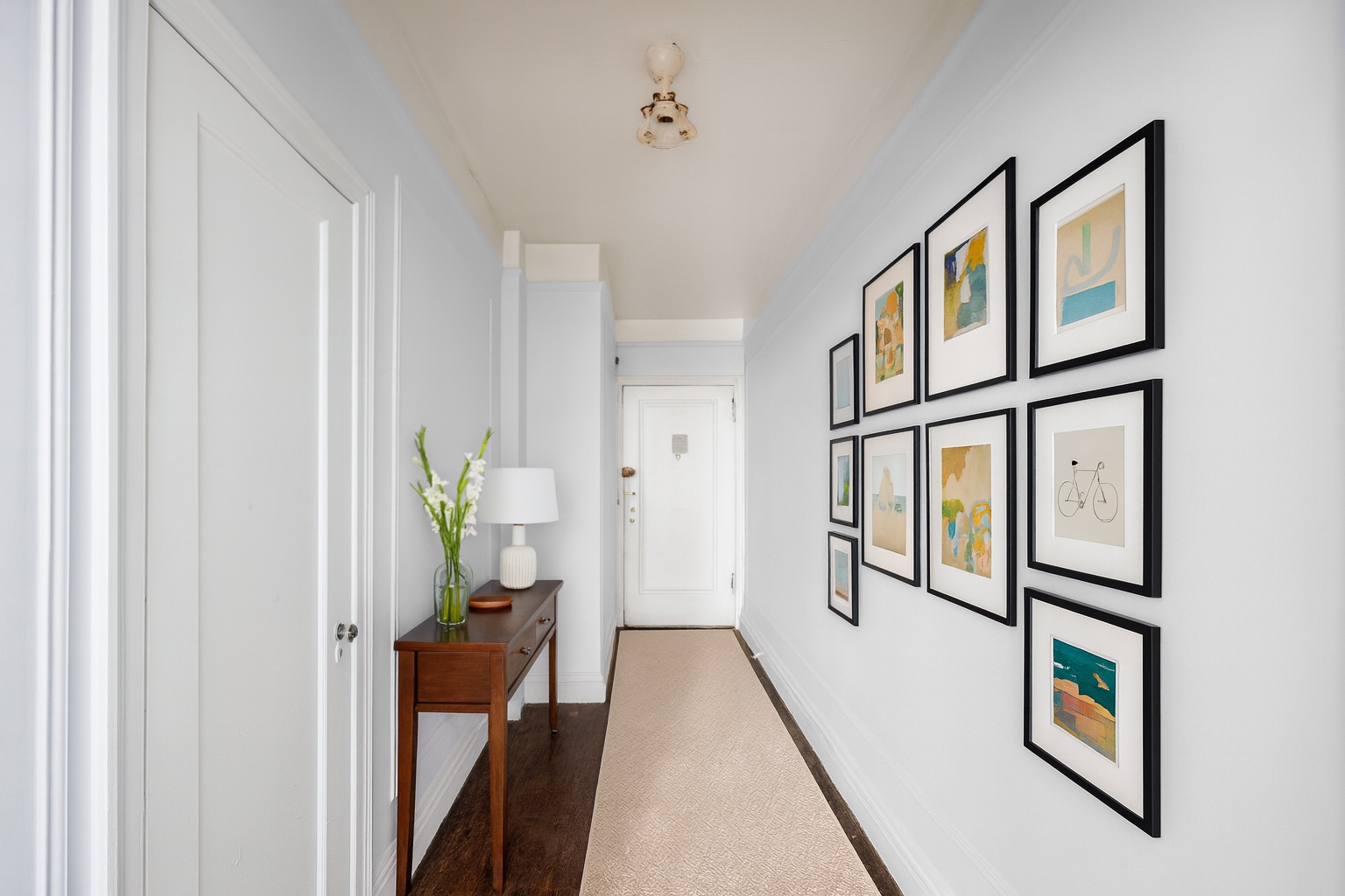 Undisclosed Address Manhattan, NY 10021 - Photo 6 of 7 a view of hallway with furniture and a window