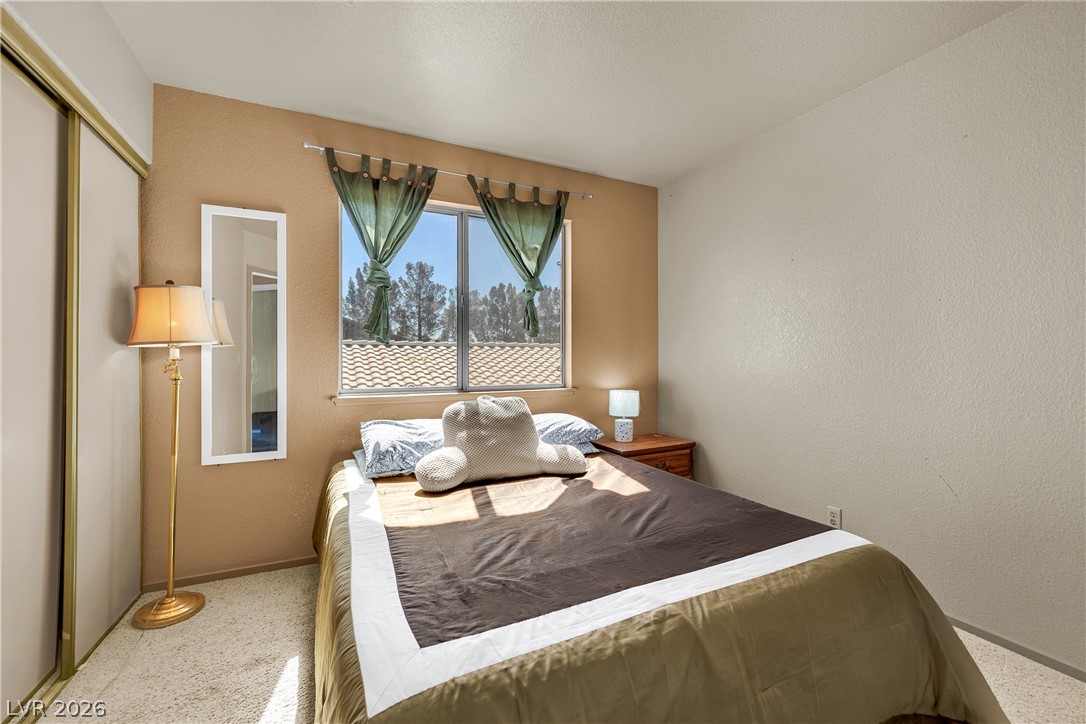 8057 Cimarron Ridge Drive Las Vegas, NV 89128 - Photo 24 of 28 Guest Bedroom