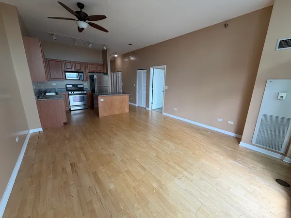 a view of kitchen and refrigerator