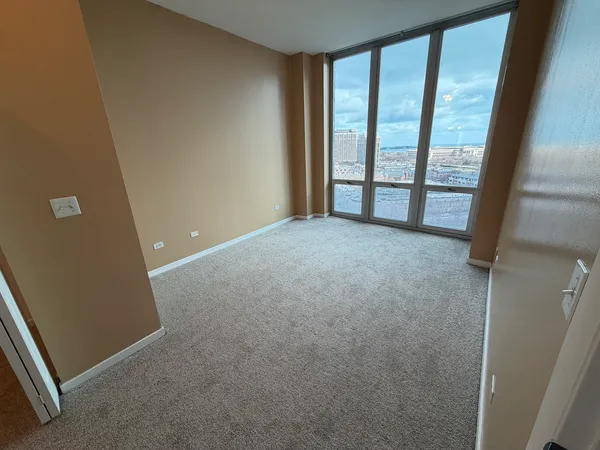 a view of an empty room with a window