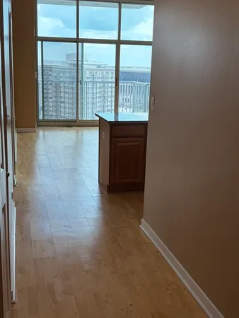 a view of an empty room and a window