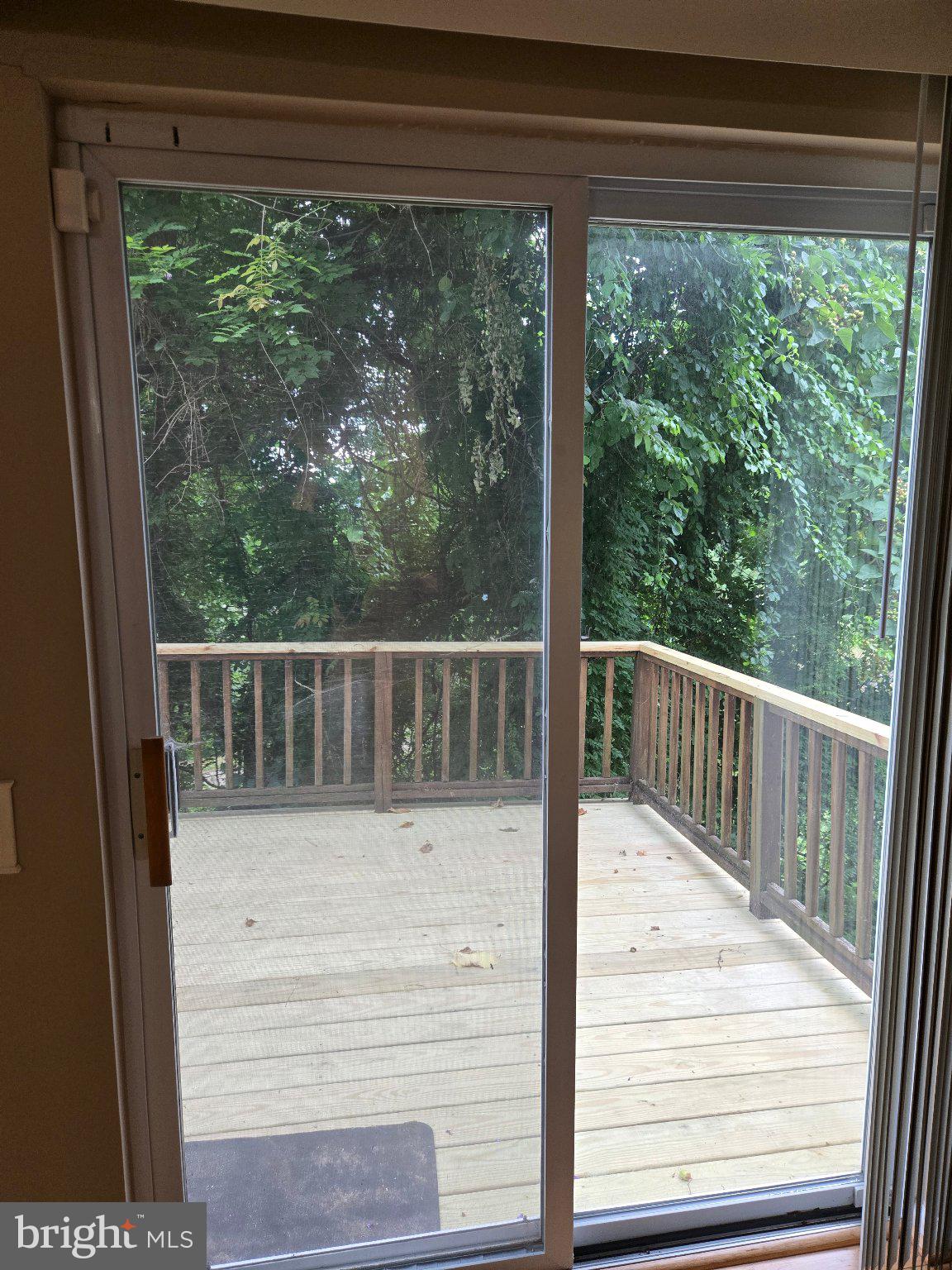 1765 Rochelle Court Woodbridge, VA 22192 - Photo 7 of 34 Serene deck with lush greenery view.